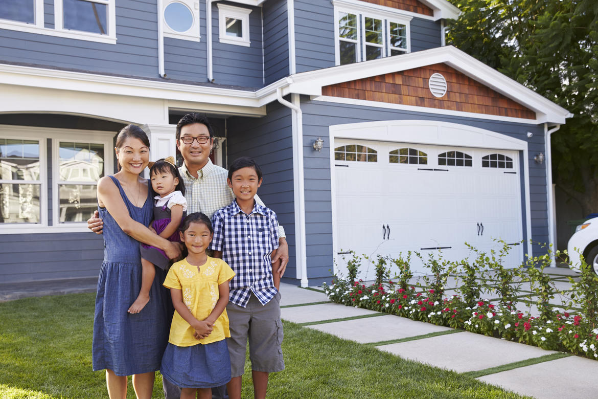 Family in front of a house